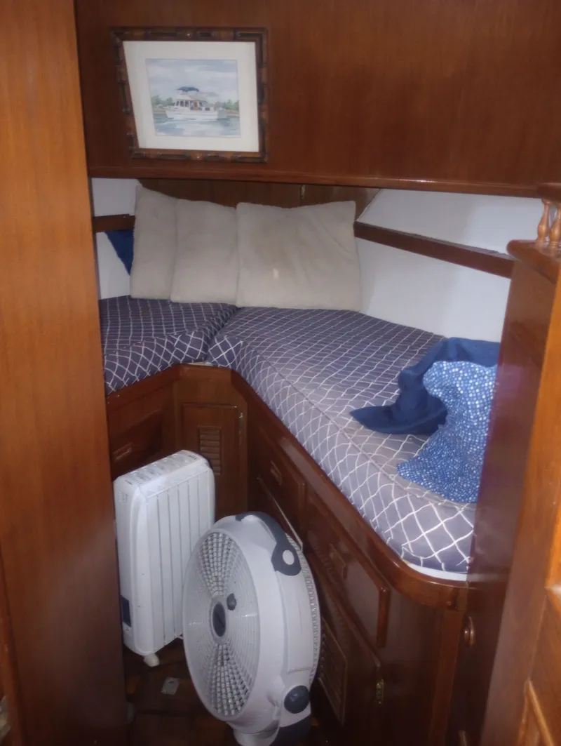 Slide: The Image of Interior of 1981 Marine Trading 44 Double Cabin with cozy bed. - 34