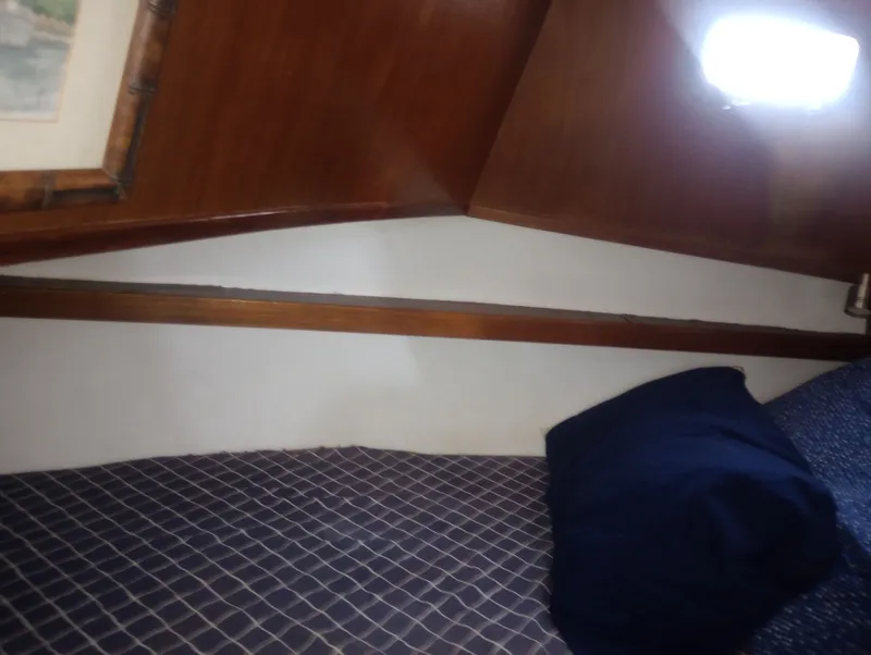 Slide: The Image of Interior of 1981 Marine Trading 44 Double Cabin with wooden walls. - 36