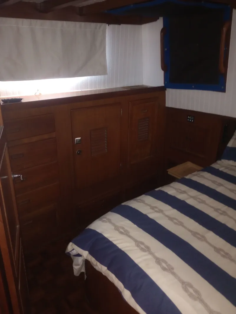 Slide: The Image of Interior of 1981 Marine Trading 44 Double Cabin with wooden furnishings. - 39