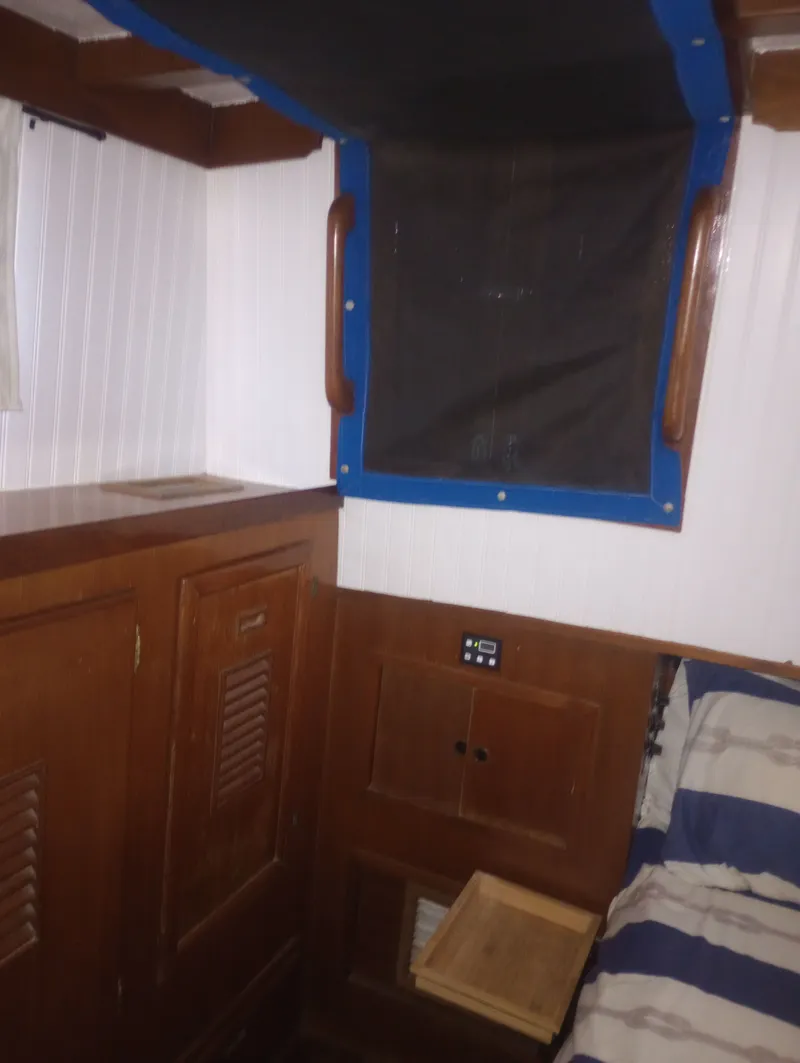 Slide: The Image of Interior of 1981 Marine Trading 44 Double Cabin with wooden furnishings. - 43