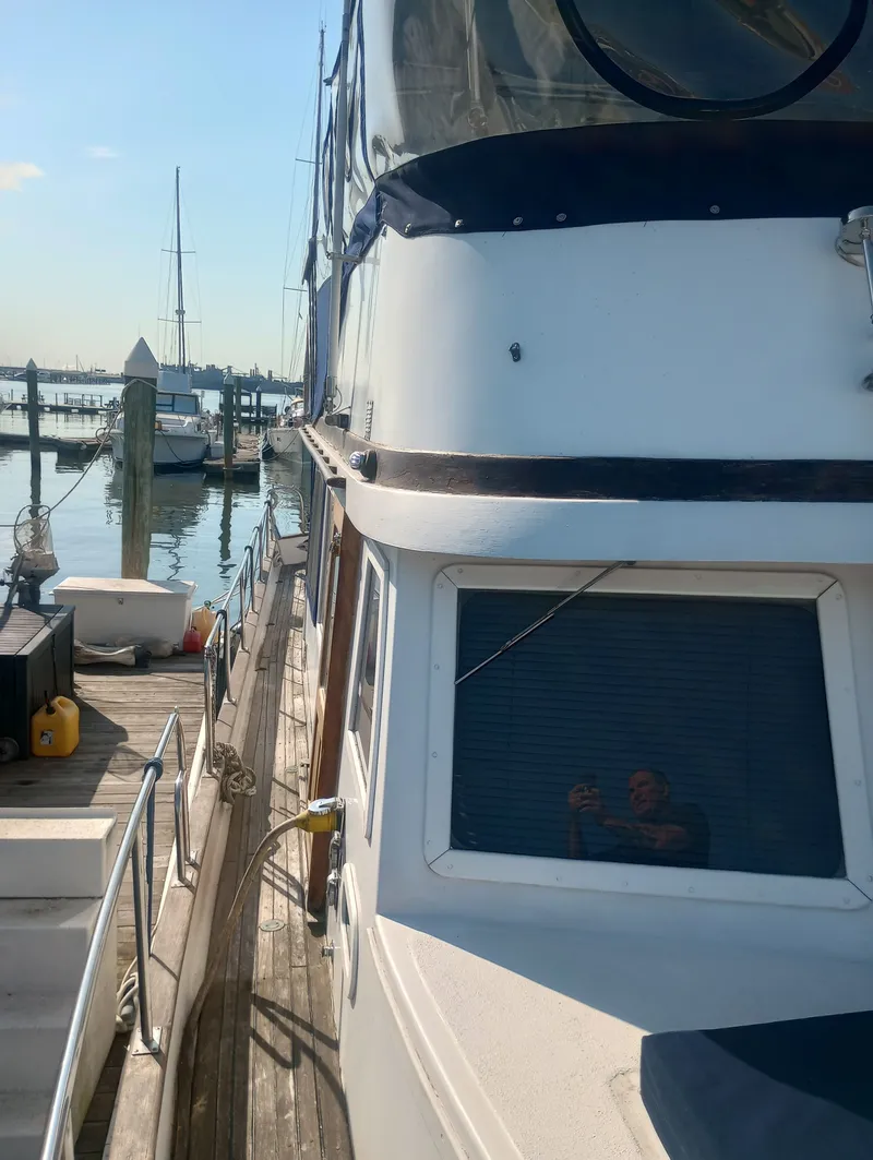 Slide: The Image of 1981 Marine Trading 44 Double Cabin at dock, sunny day. - 7