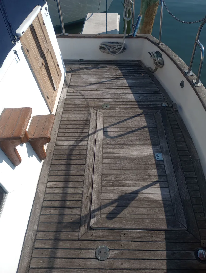Slide: The Image of Wooden deck of a 1981 Marine Trading 44 Double Cabin yacht. - 8