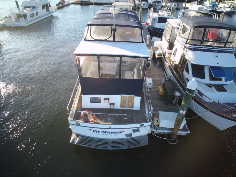 Slide: The Image of 1981 Marine Trader 44 Double Cabin docked at a marina. - 4