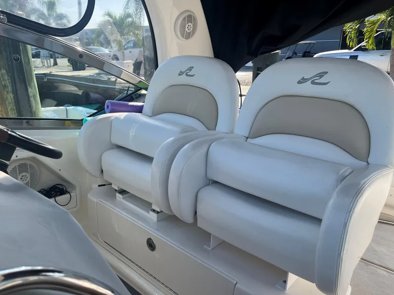 Slide: The Image of Luxury seating on 2008 Sea Ray 340 Sundancer boat, featuring plush white upholstery. - 12