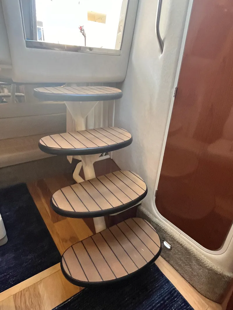 Slide: The Image of Interior stairs of 2008 Sea Ray 340 Sundancer yacht with wooden steps. - 23