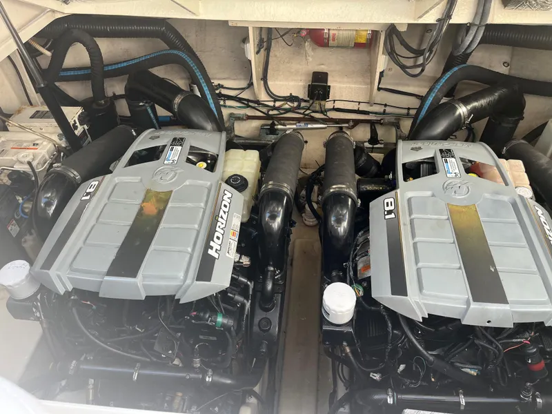 Slide: The Image of Twin engines of a 2008 Sea Ray 340 Sundancer boat in the engine compartment. - 28