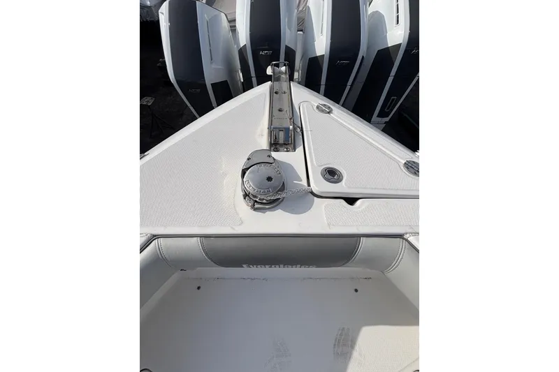 Slide: The Image of Bow view of 2017 Everglades 255 Center Console boat with anchor and storage compartments. - 15