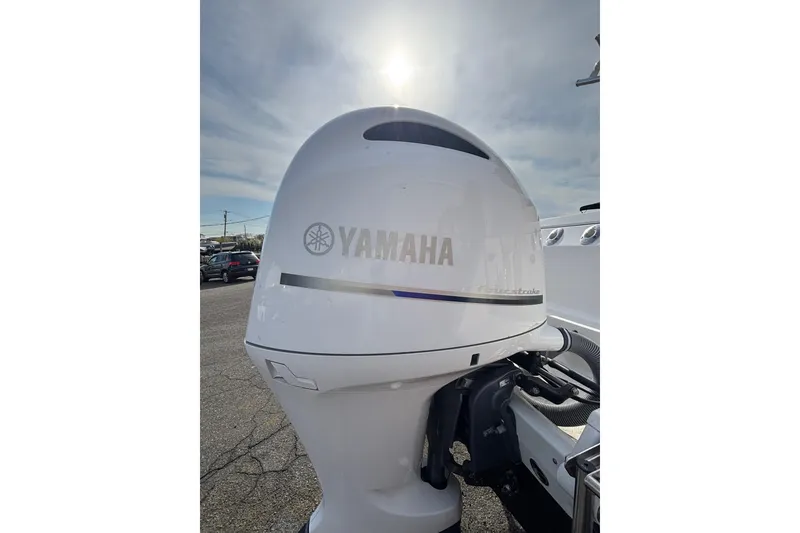Slide: The Image of Yamaha outboard motor on a 2017 Everglades 255 Center Console boat under a sunny sky. - 19
