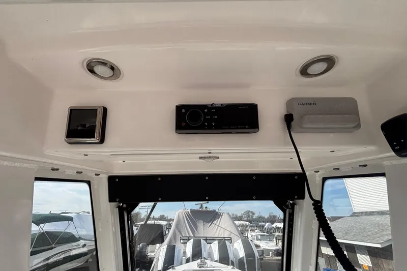 Slide: The Image of Interior view of a 2017 Everglades 255 Center Console boat with electronic equipment. - 21