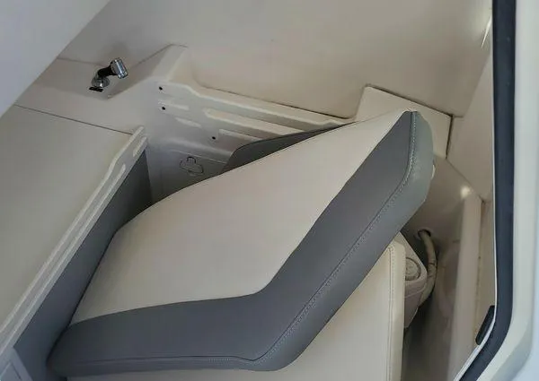 Slide: The Image of 2017 Everglades 255 Center Console interior with cushioned seating and storage area. - 23