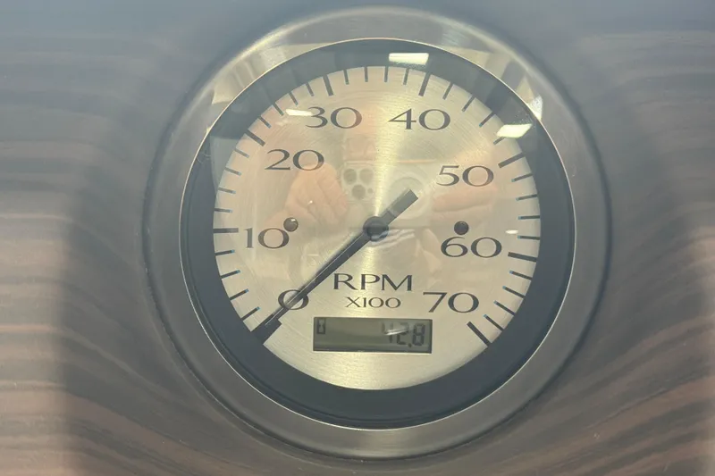 Slide: The Image of Tachometer displaying RPM on 2024 Bennington 24 L Swingback boat dashboard. - 10