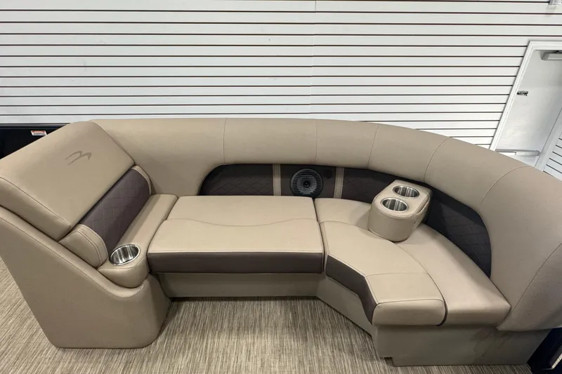 Slide: The Image of 2024 Bennington 24 L Swingback boat seating with cup holders and beige upholstery. - 15