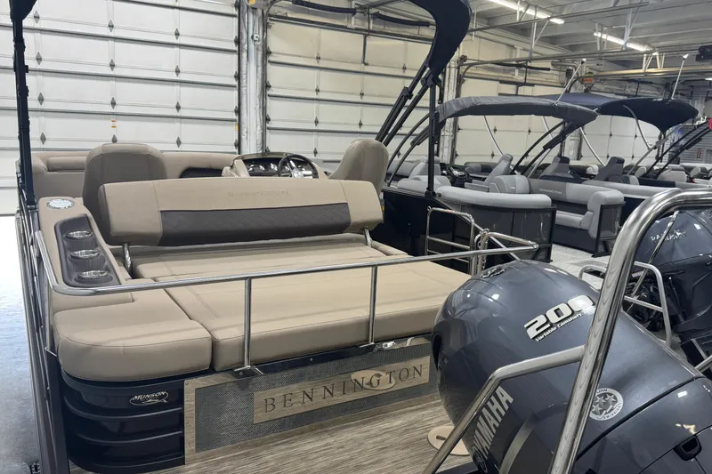 Slide: The Image of 2024 Bennington 24 L Swingback pontoon boat with Yamaha 200 engine in showroom. - 22