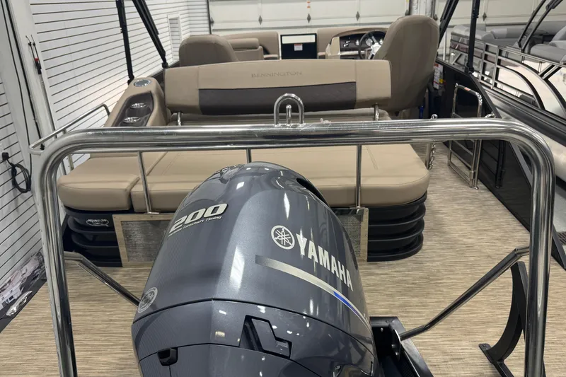 Slide: The Image of 2024 Bennington 24 L Swingback pontoon boat with Yamaha 200 engine in showroom. - 23