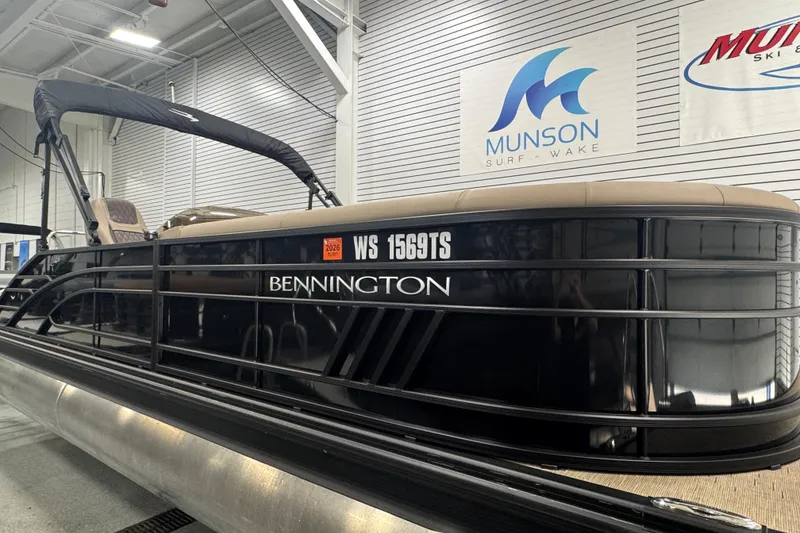 Slide: The Image of 2024 Bennington 24 L Swingback pontoon boat displayed indoors at Munson Surf & Wake. - 5