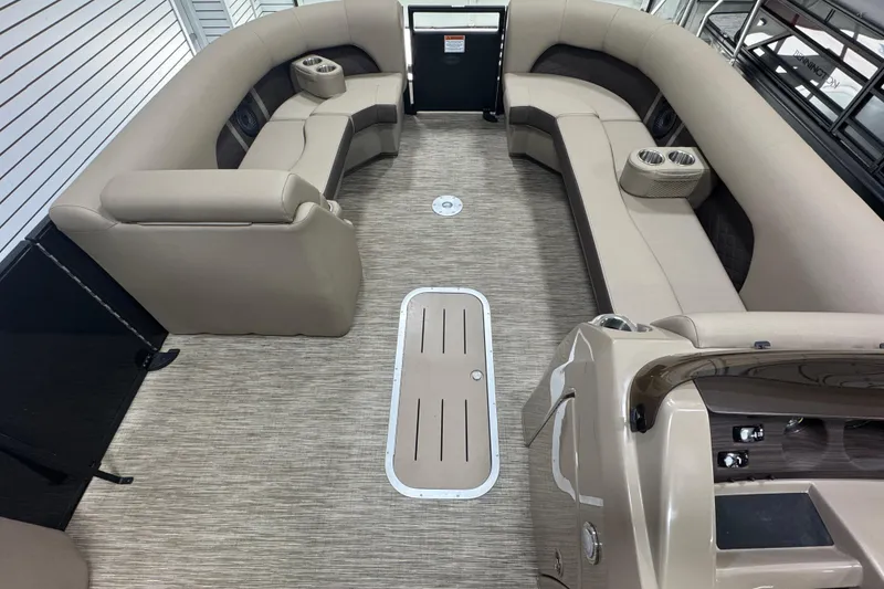 Slide: The Image of 2024 Bennington 24 L Swingback pontoon boat interior with beige seating and modern design. - 6