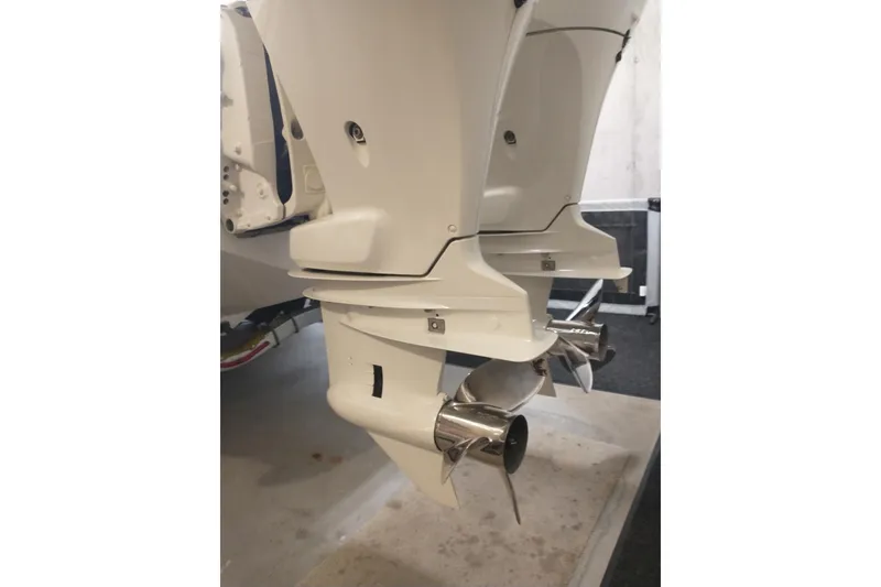 Slide: The Image of Twin outboard motors on a 2019 Concept 30' Open Deck boat. - 12
