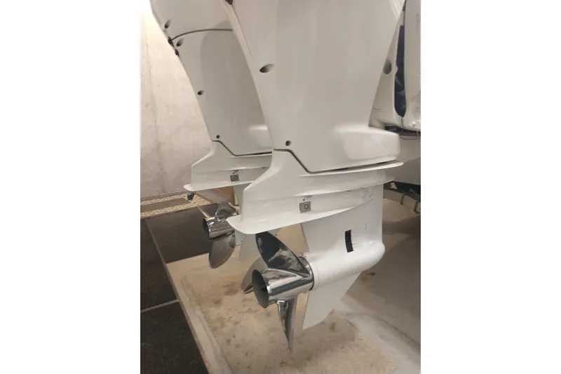 Slide: The Image of Twin outboard motors on a 2019 Concept 30' Open Deck boat. - 13