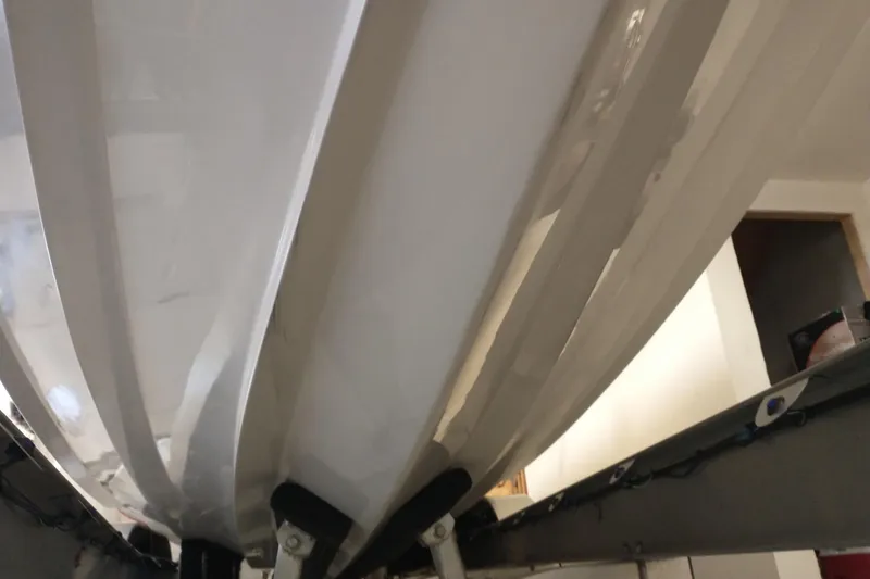 Slide: The Image of Underside view of a 2019 Concept 30' Open Deck boat on a trailer. - 16