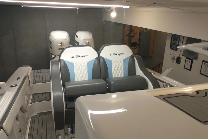 Slide: The Image of 2019 Concept 30' Open Deck boat interior with dual seats and Suzuki outboard engines. - 23