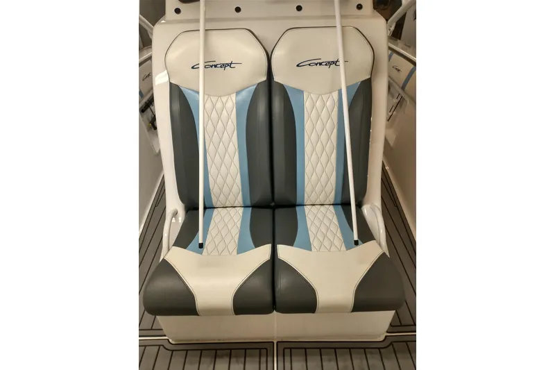 Slide: The Image of Luxury seating on 2019 Concept 30' Open Deck boat, featuring stylish blue and white upholstery. - 25