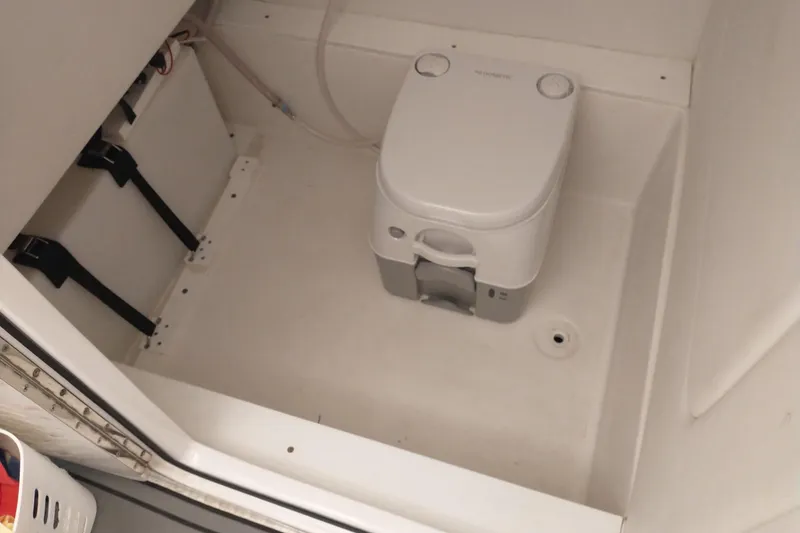 Slide: The Image of Compact marine toilet in a 2019 Concept 30' Open Deck boat bathroom. - 30
