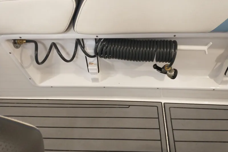 Slide: The Image of Coiled hose storage on 2019 Concept 30' Open Deck boat, featuring sleek design and functionality. - 33