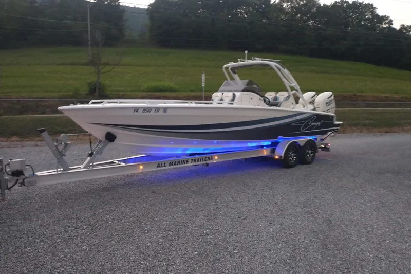 Slide: The Image of 2019 Concept 30' Open Deck boat on trailer with blue LED lights. - 4