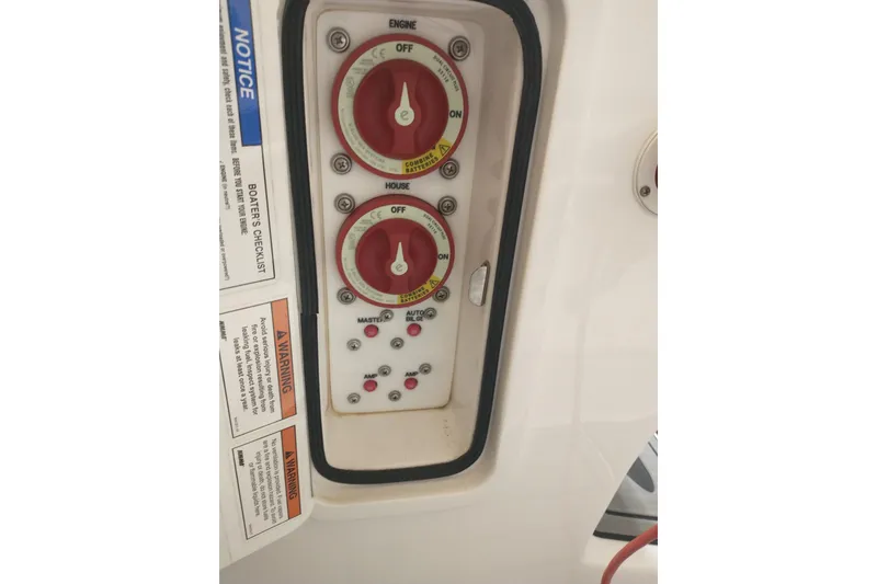 Slide: The Image of Control panel of a 2019 Concept 30' Open Deck boat with switches and warnings. - 40