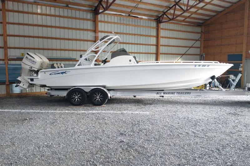 Slide: The Image of 2019 Concept 30' Open Deck boat on trailer in storage facility. - 5