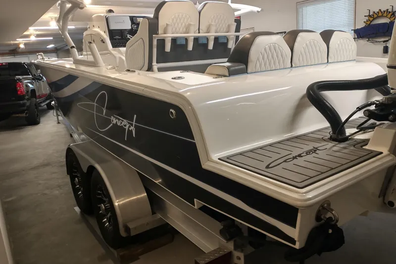 Slide: The Image of 2019 Concept 30' Open Deck boat in garage, featuring sleek design and modern seating. - 9