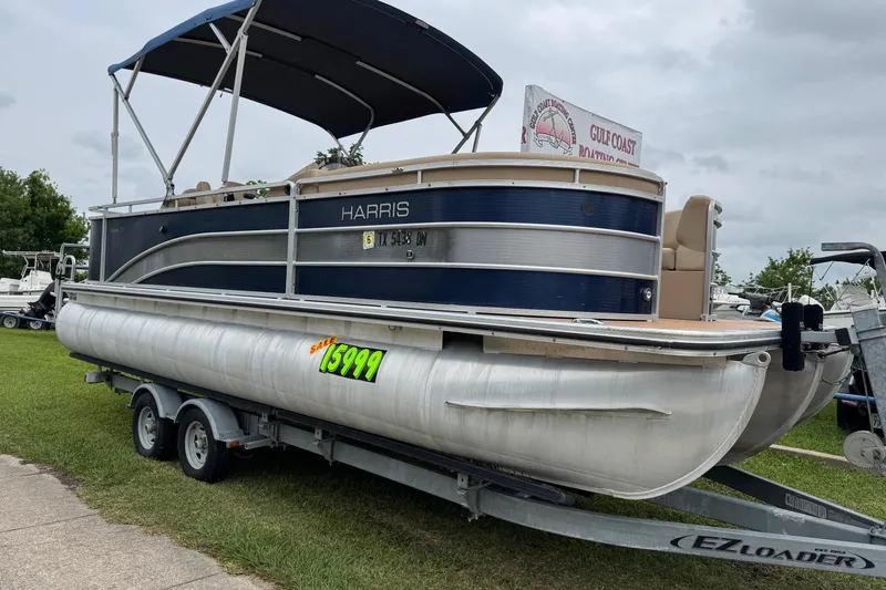 The Image of 2015 Harris FloteBote 220 Cruiser CX pontoon boat on trailer, priced at $15,999. - 0
