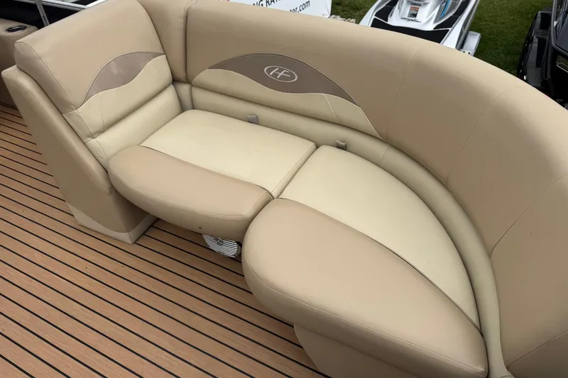 Slide: The Image of Luxurious seating on 2015 Harris FloteBote 220 Cruiser CX pontoon boat, featuring beige upholstery. - 10