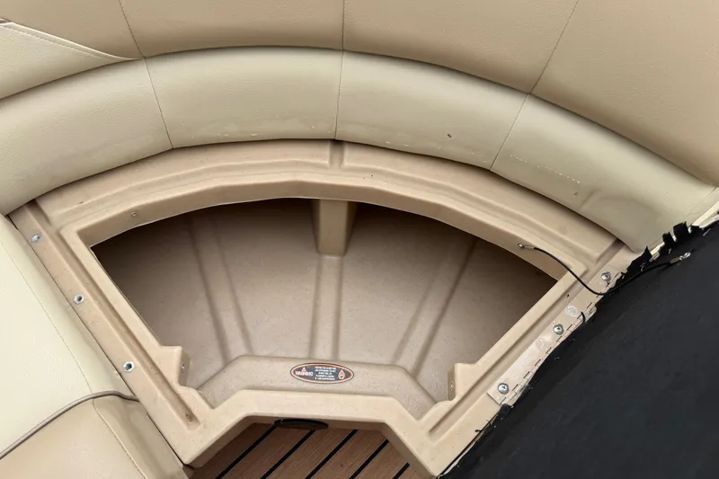 Slide: The Image of 2015 Harris FloteBote 220 Cruiser CX storage compartment with beige seating. - 12