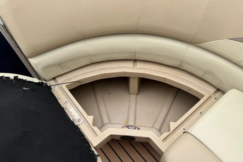 Slide: The Image of Open storage compartment on a 2015 Harris FloteBote 220 Cruiser CX boat. - 14