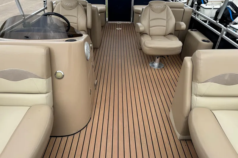 Slide: The Image of 2015 Harris FloteBote 220 Cruiser CX interior with beige seating and wood-style flooring. - 16