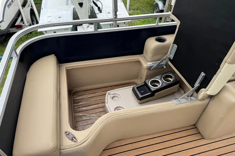 Slide: The Image of 2015 Harris FloteBote 220 Cruiser CX interior with beige seating and cup holders. - 19