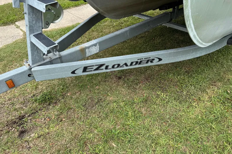 Slide: The Image of Trailer for 2015 Harris FloteBote 220 Cruiser CX on grass. - 2