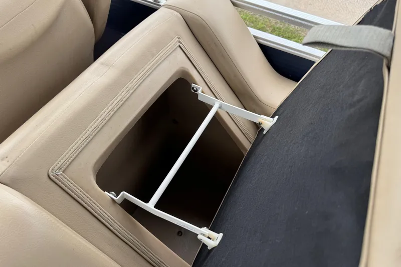 Slide: The Image of 2015 Harris FloteBote 220 Cruiser CX seat storage compartment, open and empty. - 20