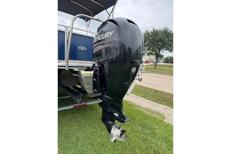 Slide: The Image of 2015 Harris FloteBote 220 Cruiser CX with Mercury outboard motor on grass. - 25