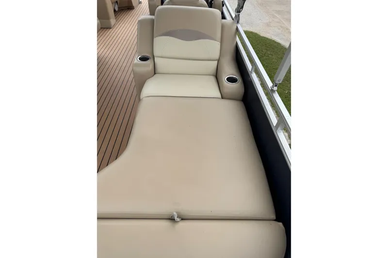 Slide: The Image of Beige seating on 2015 Harris FloteBote 220 Cruiser CX with cup holders and wood-style flooring. - 3