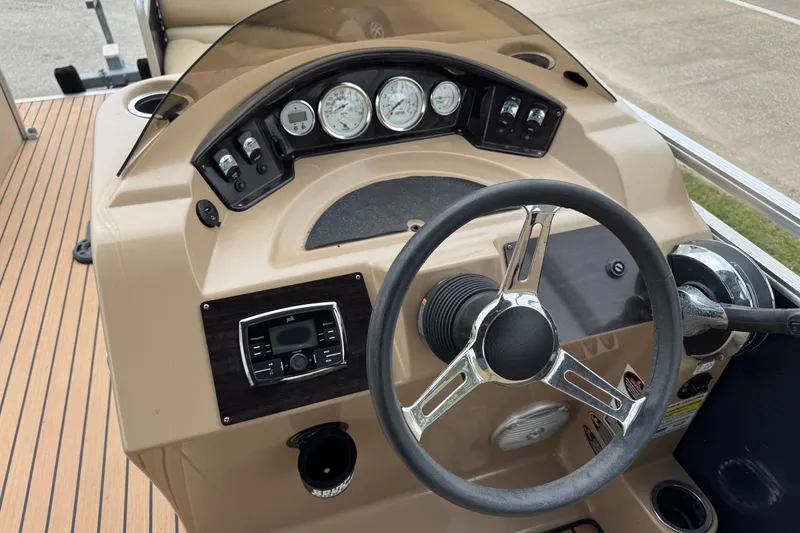 Slide: The Image of 2015 Harris FloteBote 220 Cruiser CX dashboard with steering wheel and gauges. - 5