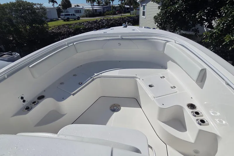 Slide: The Image of 2018 Edgewater 280CC boat interior with seating and storage compartments. - 8
