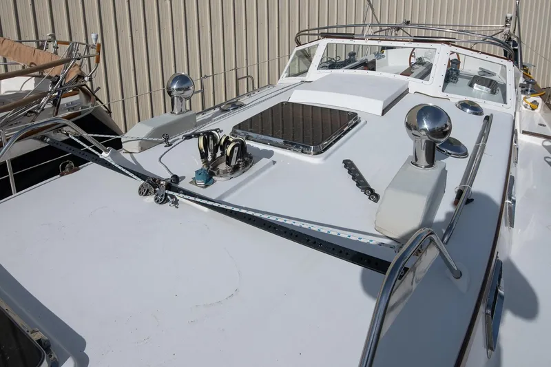 Slide: The Image of Deck view of a 1999 Gozzard 37A sailboat, showcasing sleek design and equipment. - 10
