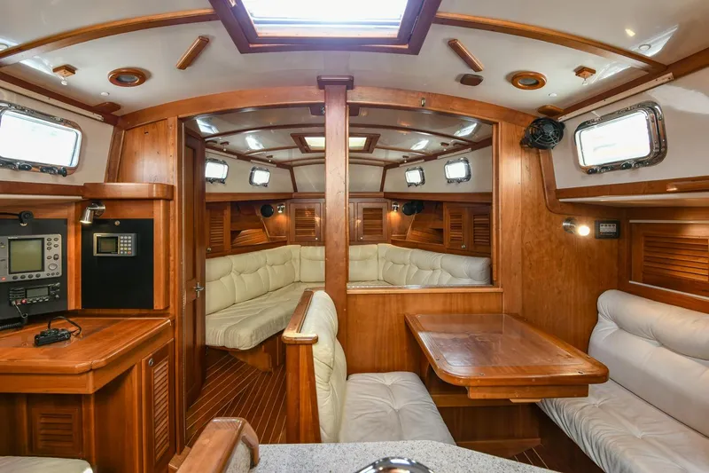 Slide: The Image of Luxurious interior of 1999 Gozzard 37A yacht with wood finish and plush seating. - 16