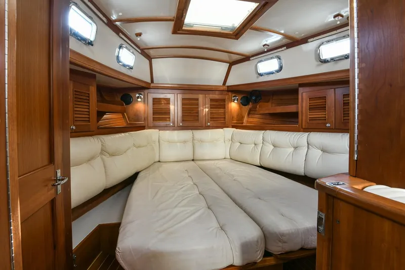 Slide: The Image of Luxurious interior of 1999 Gozzard 37A yacht with plush seating and wooden cabinetry. - 19