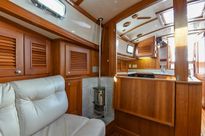Slide: The Image of Luxurious interior of 1999 Gozzard 37A yacht with wood finish and plush seating. - 22