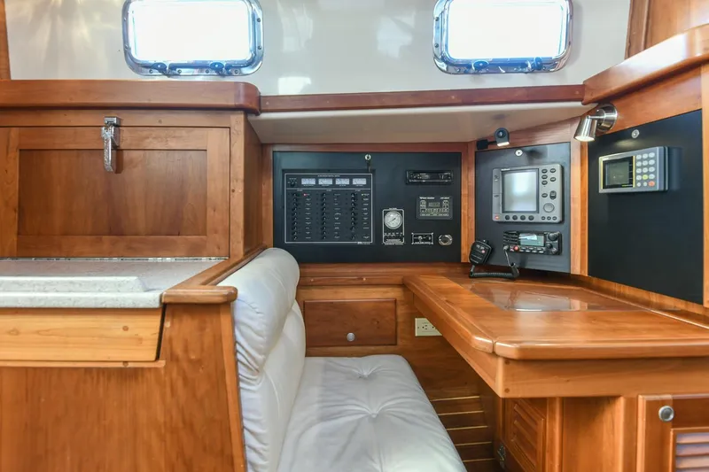 Slide: The Image of Interior of 1999 Gozzard 37A yacht with navigation equipment and wooden cabinetry. - 28