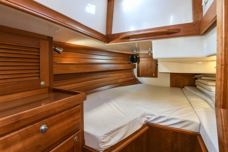 Slide: The Image of Cozy cabin interior of 1999 Gozzard 37A sailboat with wooden furnishings. - 31