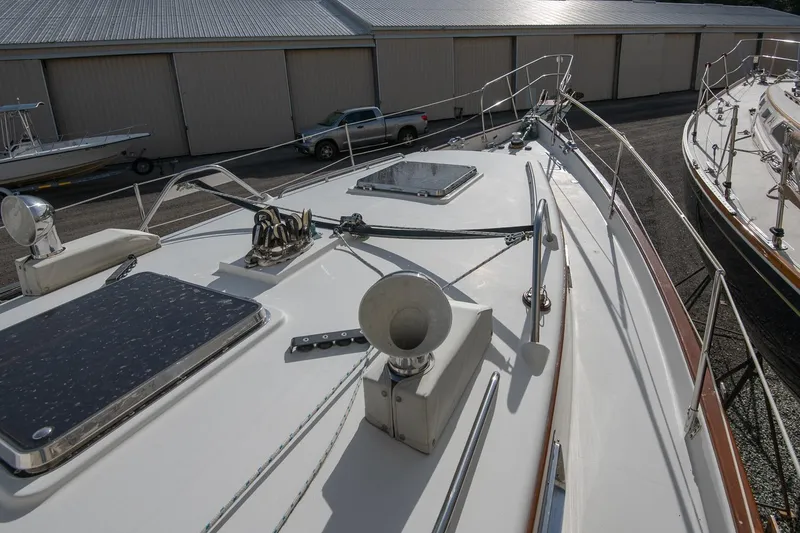 Slide: The Image of Deck view of a 1999 Gozzard 37A yacht, showcasing sleek design and equipment. - 7